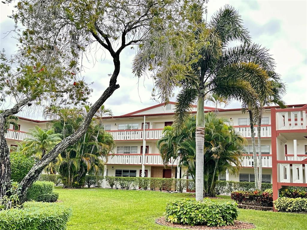 front view of a building with a yard