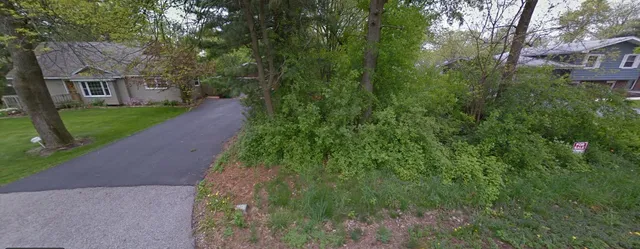a view of a house with a street