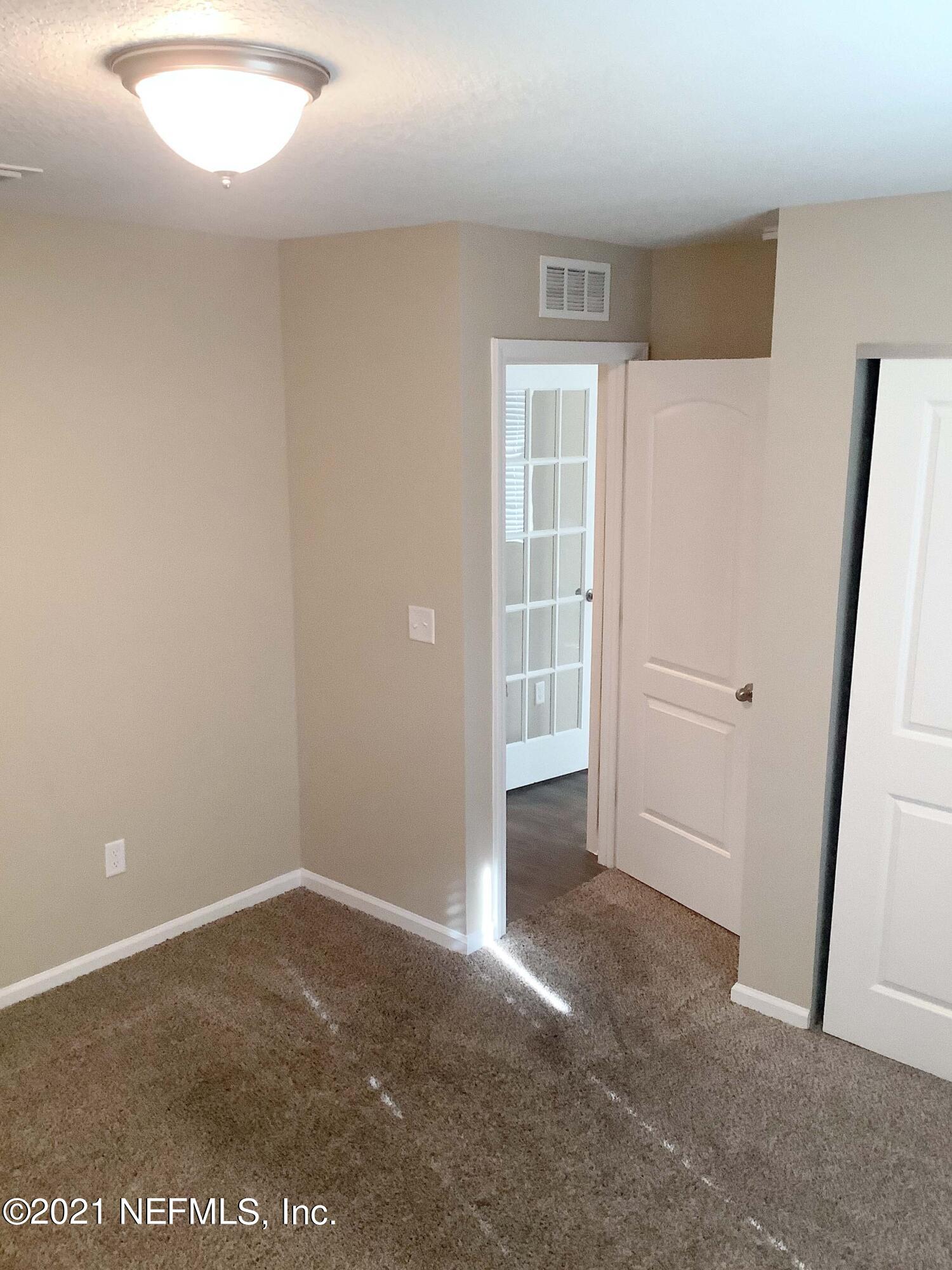 1579 Lockend Road Jacksonville, FL 32221 - Photo 5 of 15 an empty room with windows