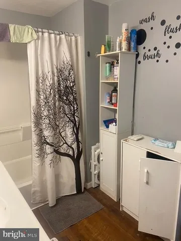 a view of storage and utility room with a window