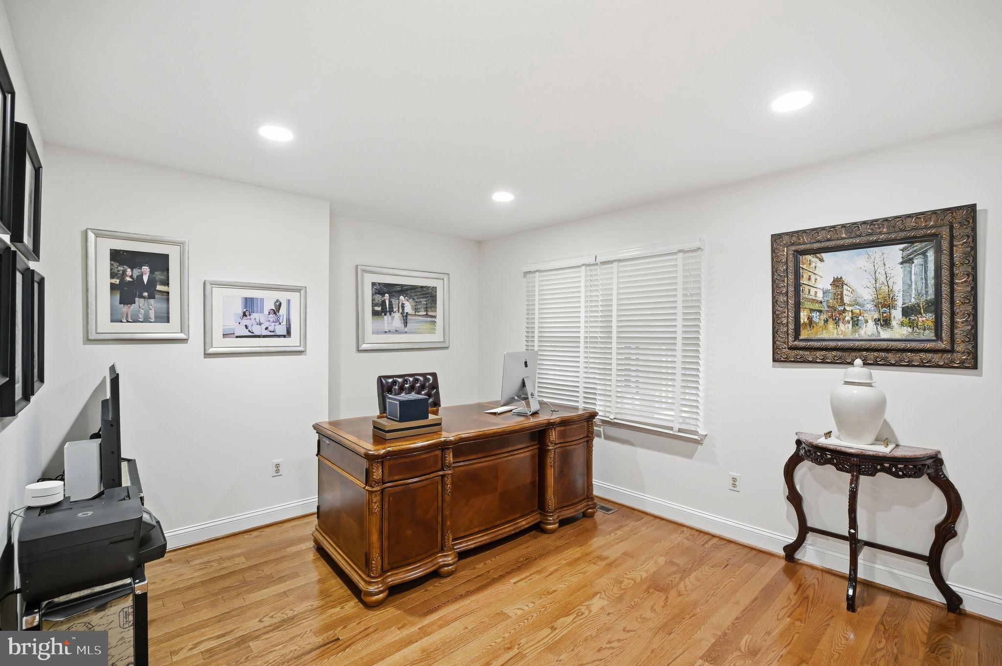 11728 Stuart Mill Road Oakton, VA 22124 - Photo 53 of 88 a living room with furniture and a window