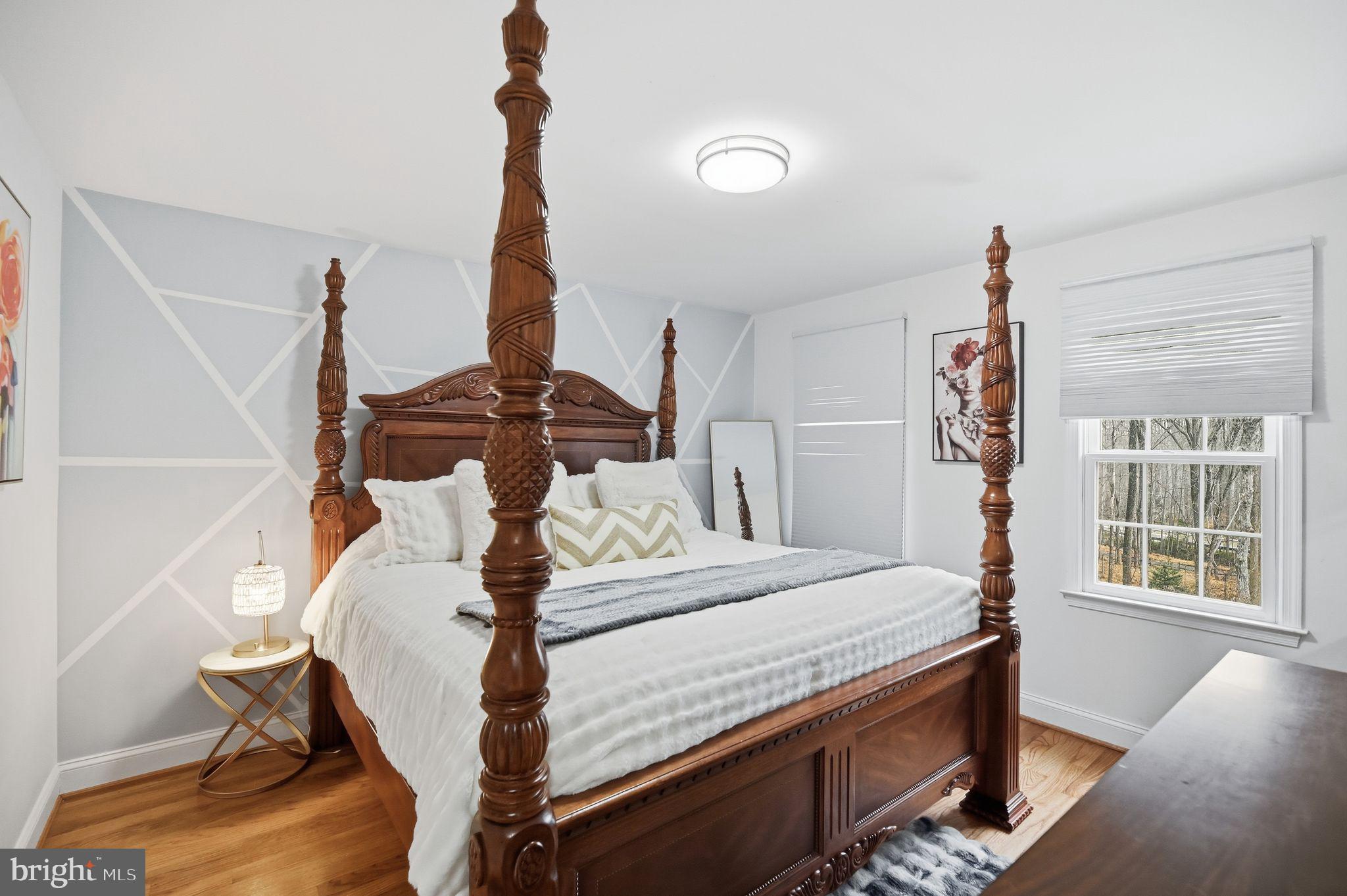 11728 Stuart Mill Road Oakton, VA 22124 - Photo 54 of 88 a bed room with a bed and a window