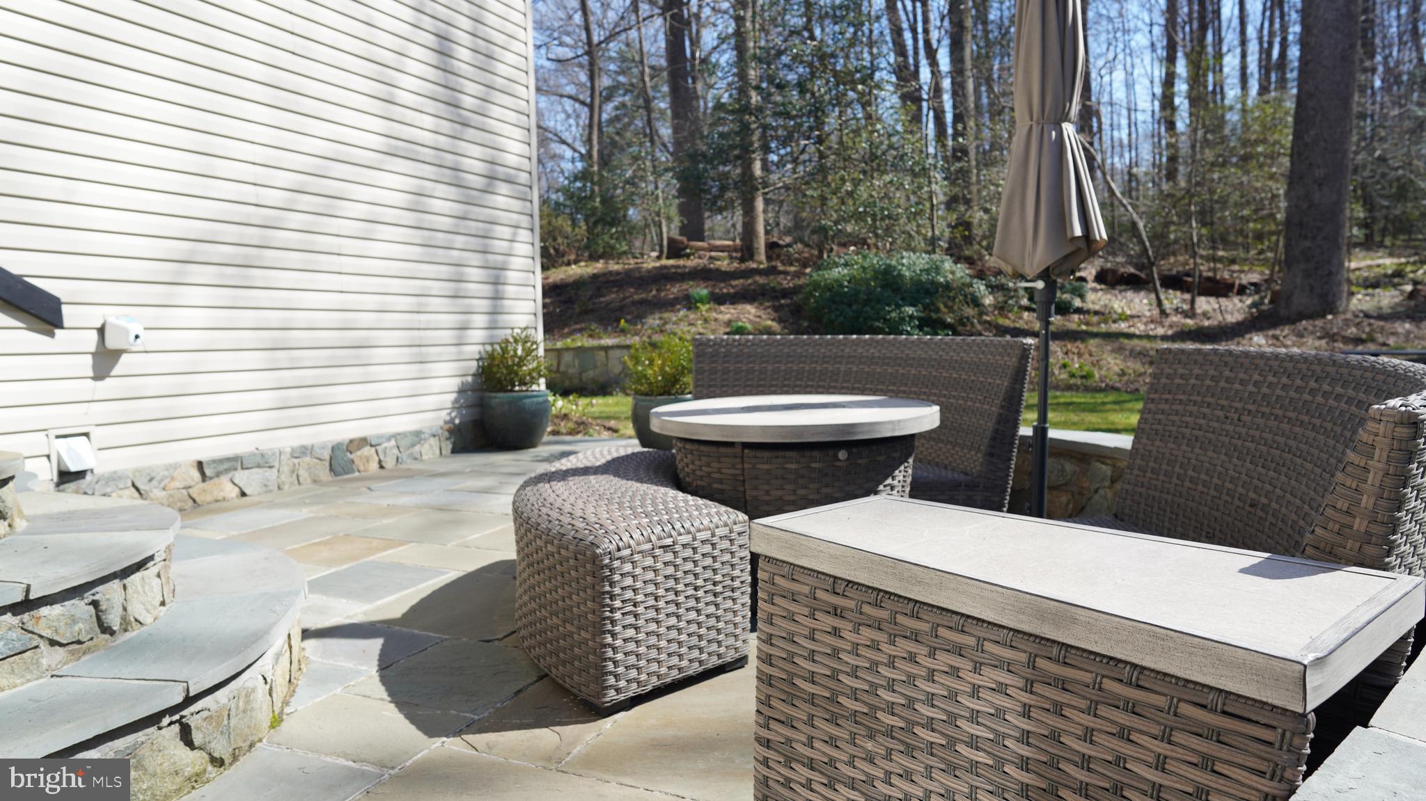 11728 Stuart Mill Road Oakton, VA 22124 - Photo 77 of 88 a view of a patio with couches chairs and a potted plant