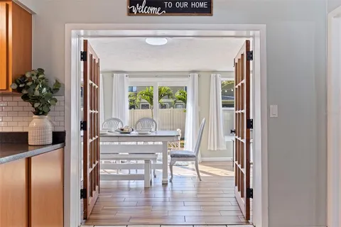 a view of dining room with wooden floor and a table chair