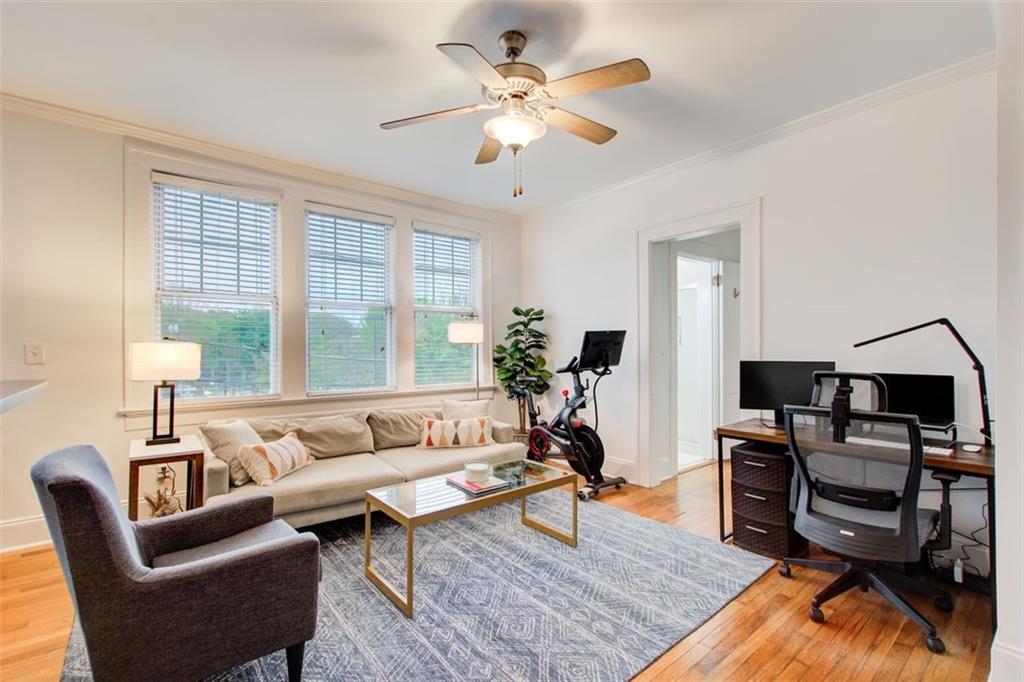 733 Frederica Street Northeast, Unit 12 Atlanta, GA 30306 - Photo 12 of 23 a living room with furniture and a window
