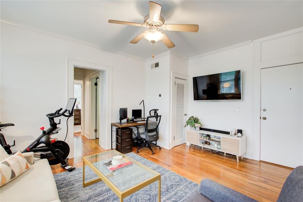 733 Frederica Street Northeast, Unit 12 Atlanta, GA 30306 - Photo 13 of 23 a living room with furniture and a flat screen tv