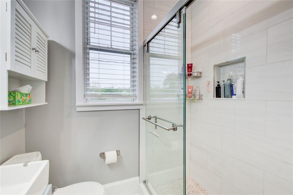 733 Frederica Street Northeast, Unit 12 Atlanta, GA 30306 - Photo 14 of 23 a bathroom with a toilet and a shower