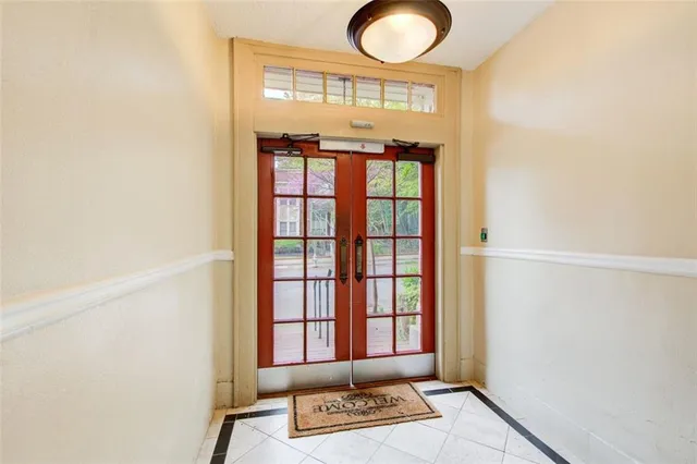 a view of entryway with a window and wooden floor