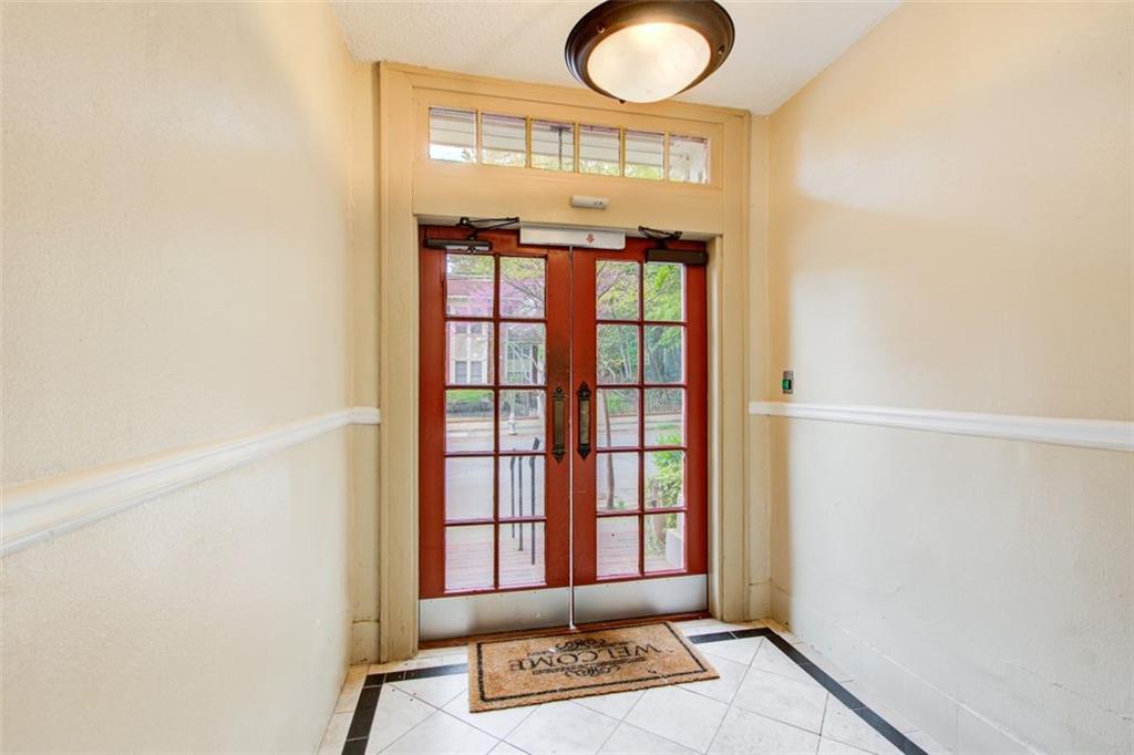 733 Frederica Street Northeast, Unit 12 Atlanta, GA 30306 - Photo 4 of 23 a view of entryway with a window and wooden floor