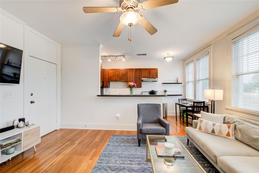 733 Frederica Street Northeast, Unit 12 Atlanta, GA 30306 - Photo 7 of 23 a living room with furniture and a flat screen tv