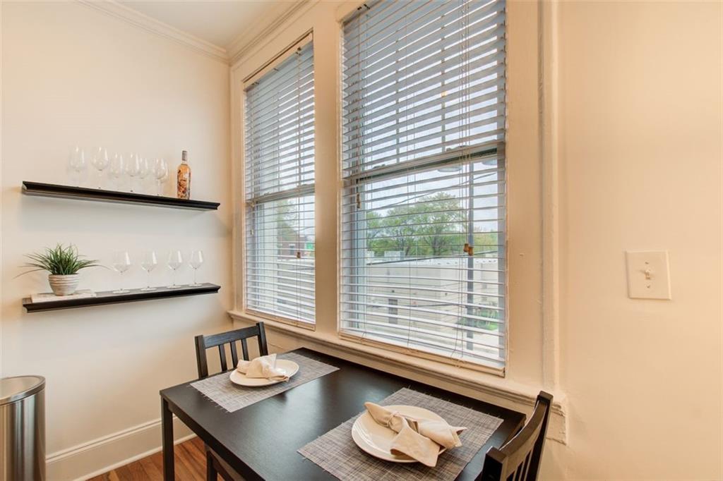 733 Frederica Street Northeast, Unit 12 Atlanta, GA 30306 - Photo 9 of 23 a living room with furniture and a window