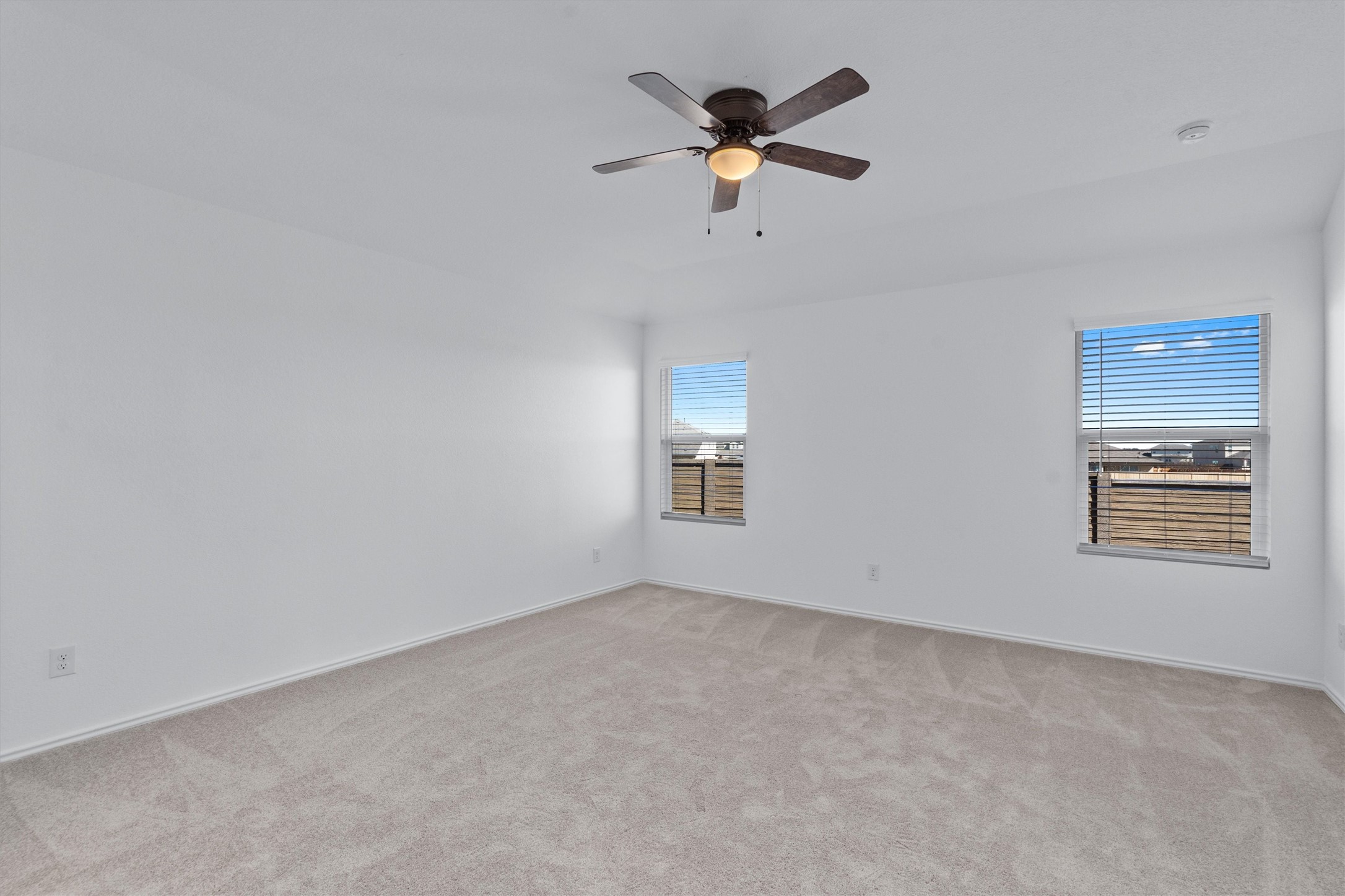 259 Sormonne Loop Kyle, TX 78640 - Photo 14 of 34 a view of a room with a ceiling fan and a window
