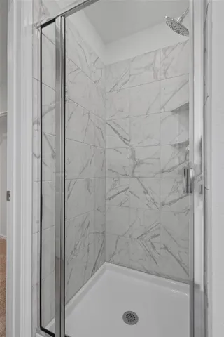 a bathroom with a sink and a shower