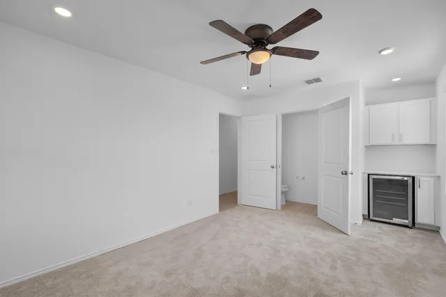 a view of an empty room with a window