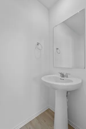 an empty room with a ceiling fan and a window