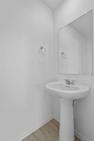 an empty room with a ceiling fan and a window