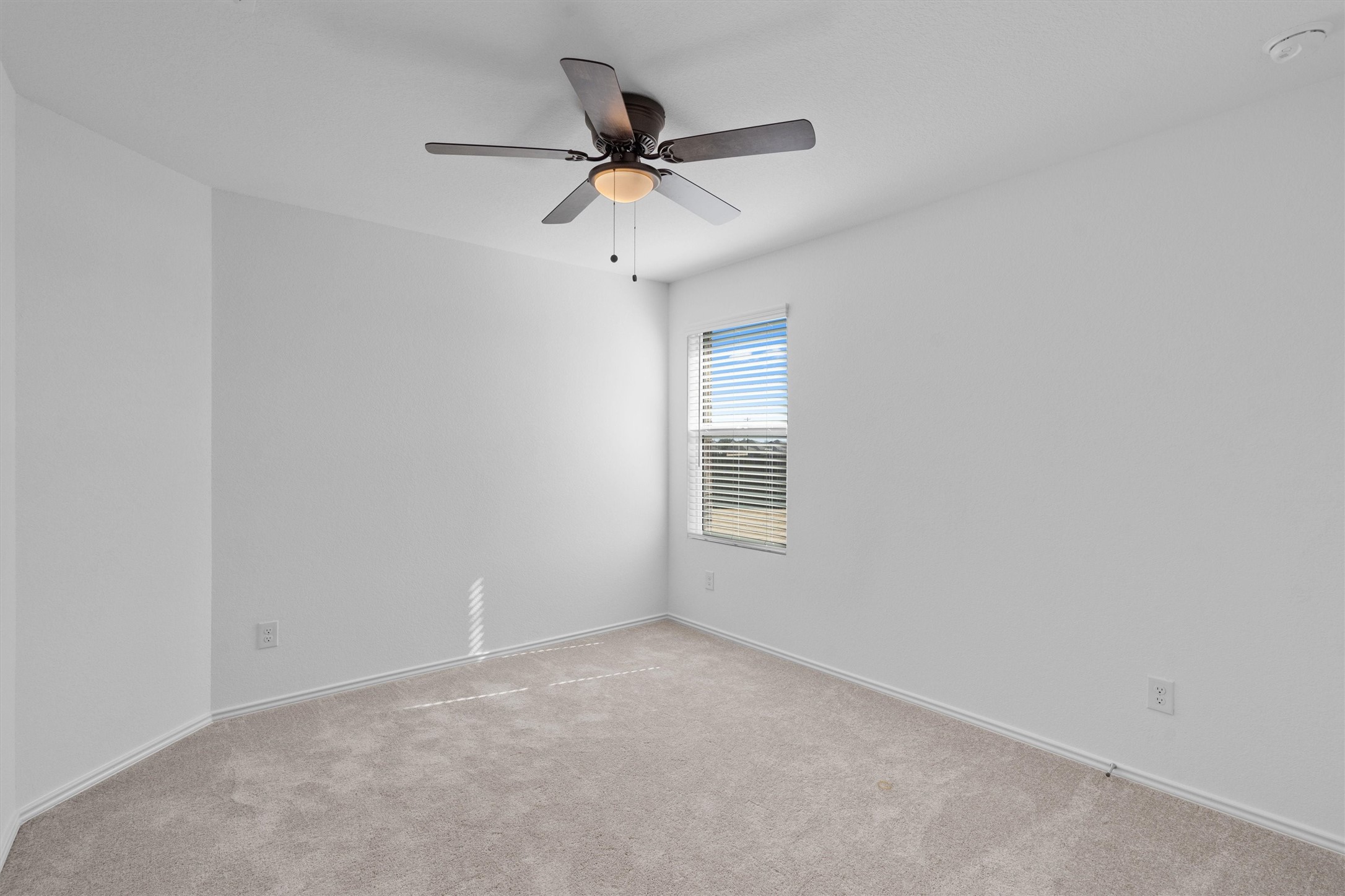 259 Sormonne Loop Kyle, TX 78640 - Photo 23 of 34 a view of a livingroom with a ceiling fan and window