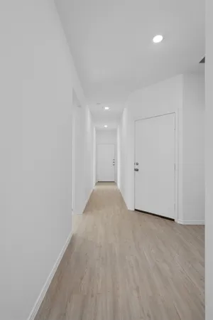 a view of a room with wooden floor