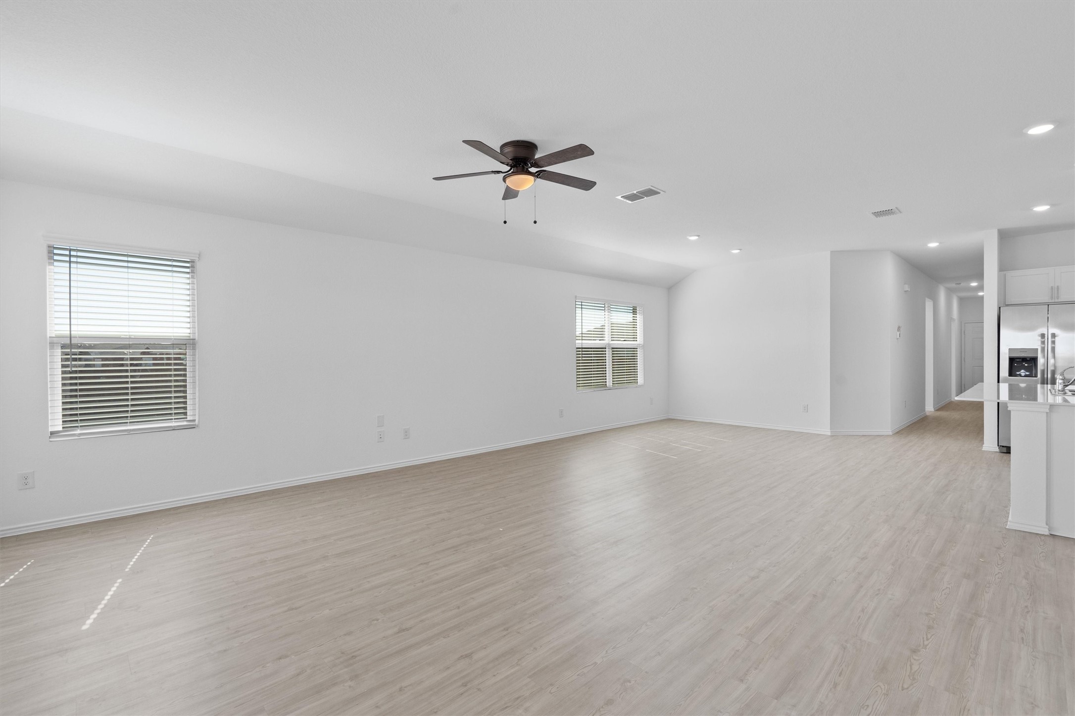 259 Sormonne Loop Kyle, TX 78640 - Photo 9 of 34 an empty room with a empty space and windows