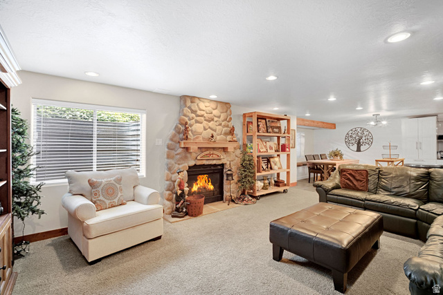 2139 Village Point Way Sandy, UT 84093 - Photo 20 of 35 Spacious entertainment area featuring a stone-faced heatilator fireplace, beautiful second kitchen (only a few years old).