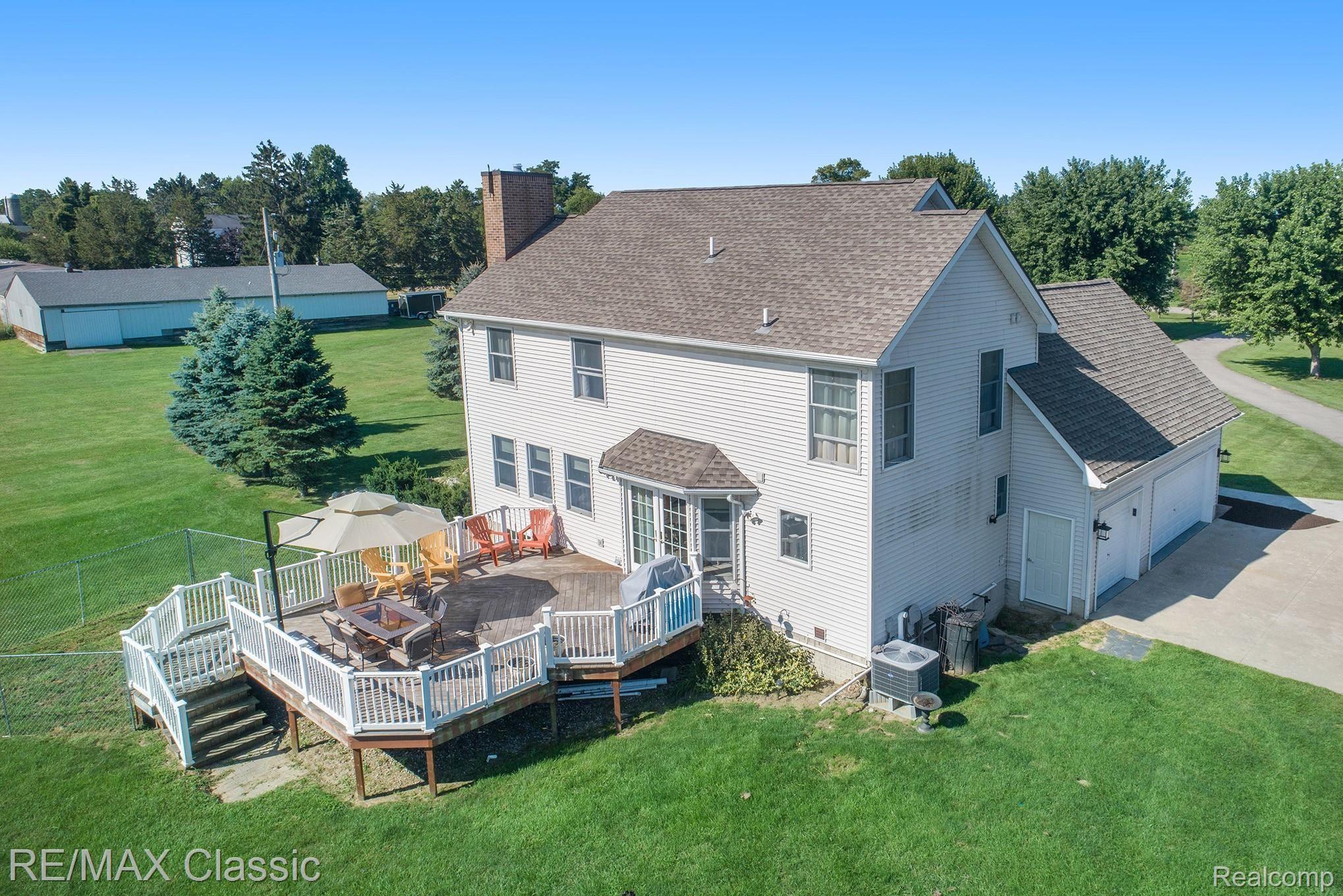 8070 Oak Grove Road Howell, MI 48855 - Photo 3 of 34 Rear view with amazing deck