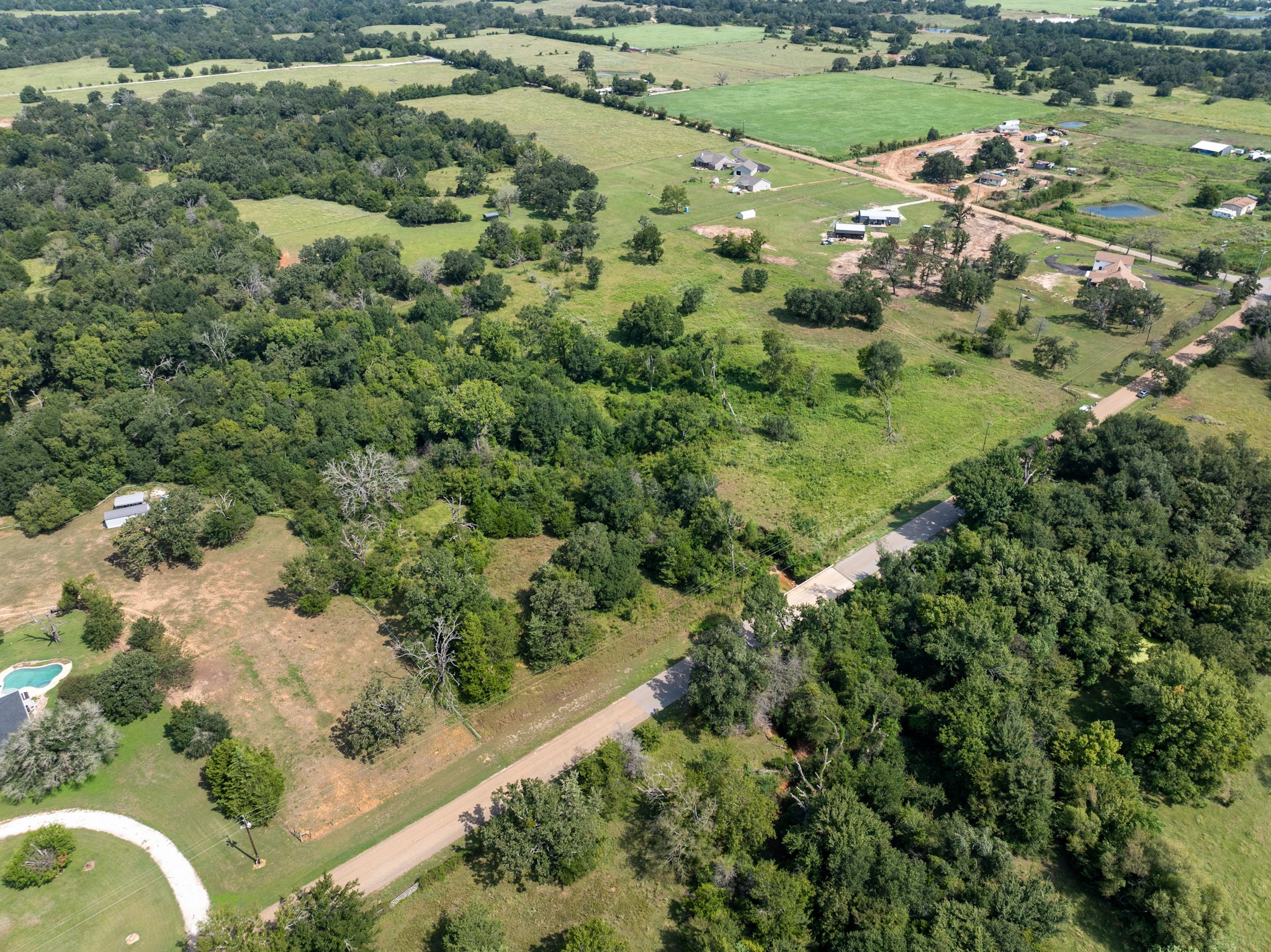 Tbd Cazey Loop Franklin, TX 77856 - Photo 13 of 20 an aerial view of residential houses with outdoor space and trees