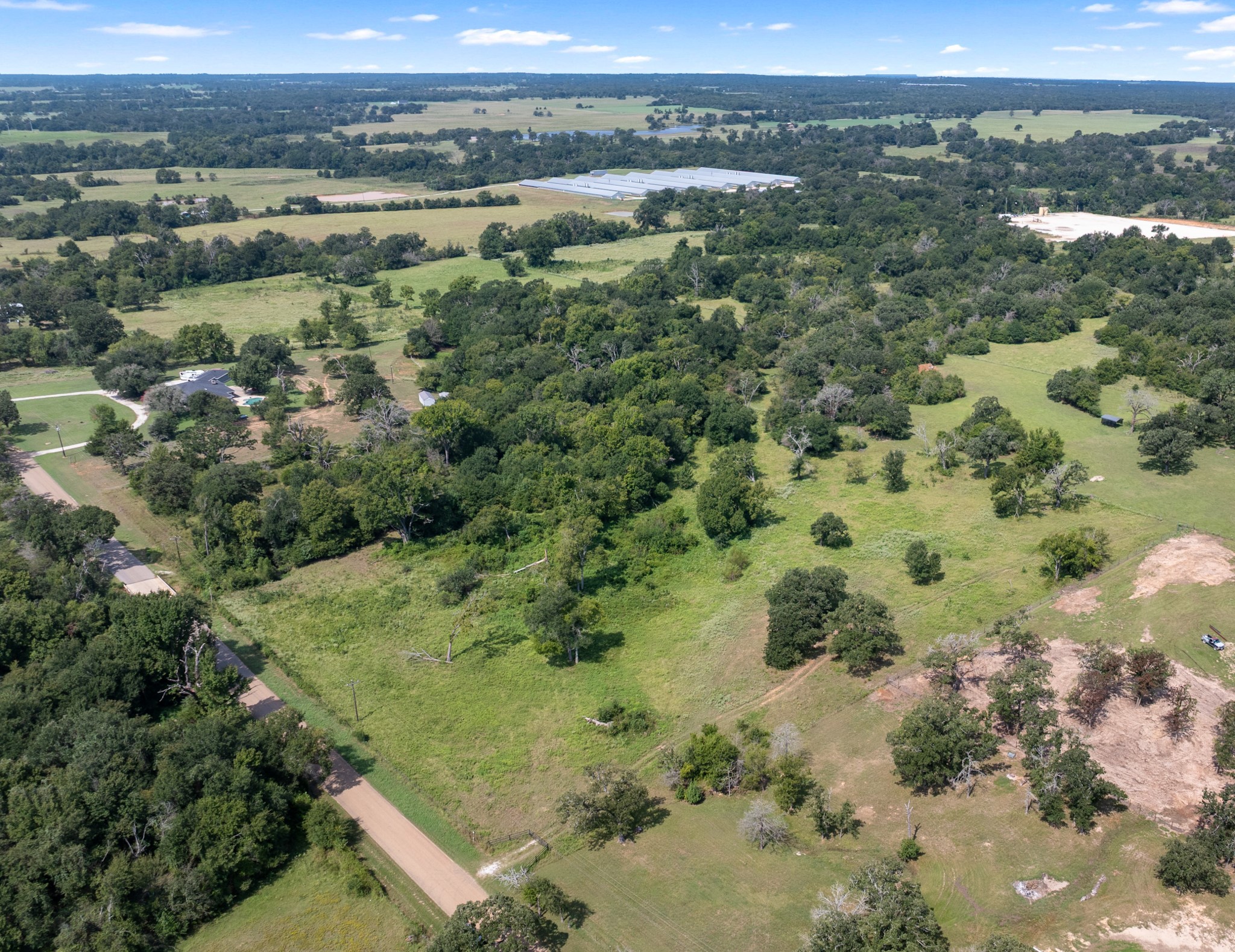 Tbd Cazey Loop Franklin, TX 77856 - Photo 13 of 20 an aerial view of green landscape with trees houses and mountain view