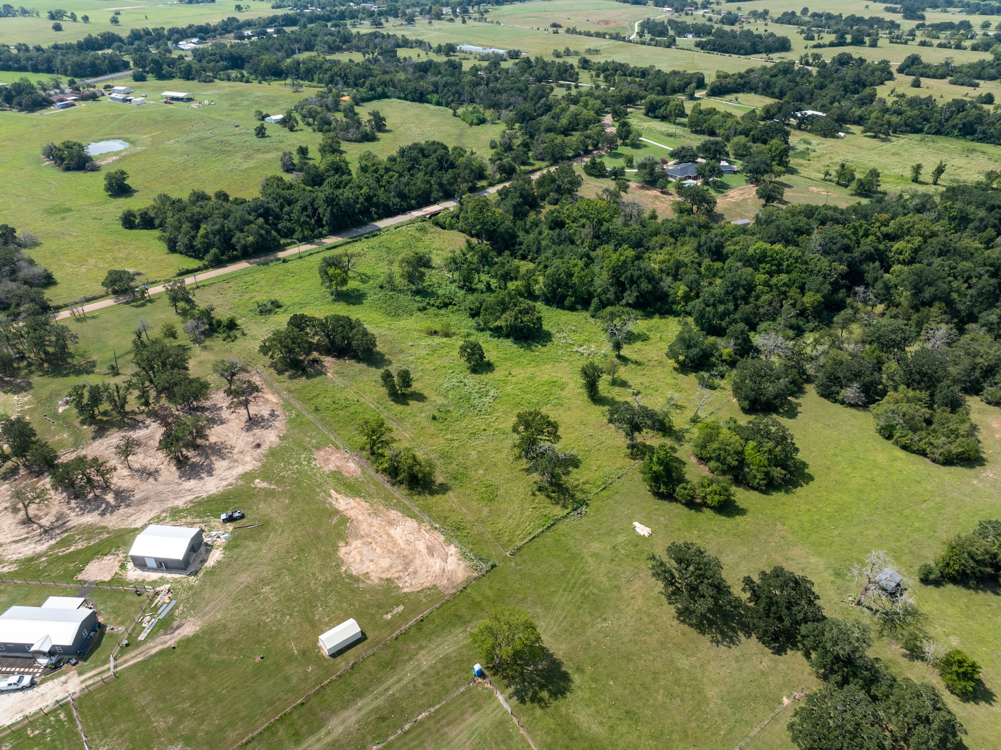 Tbd Cazey Loop Franklin, TX 77856 - Photo 9 of 20 an aerial view of residential houses with outdoor space and trees