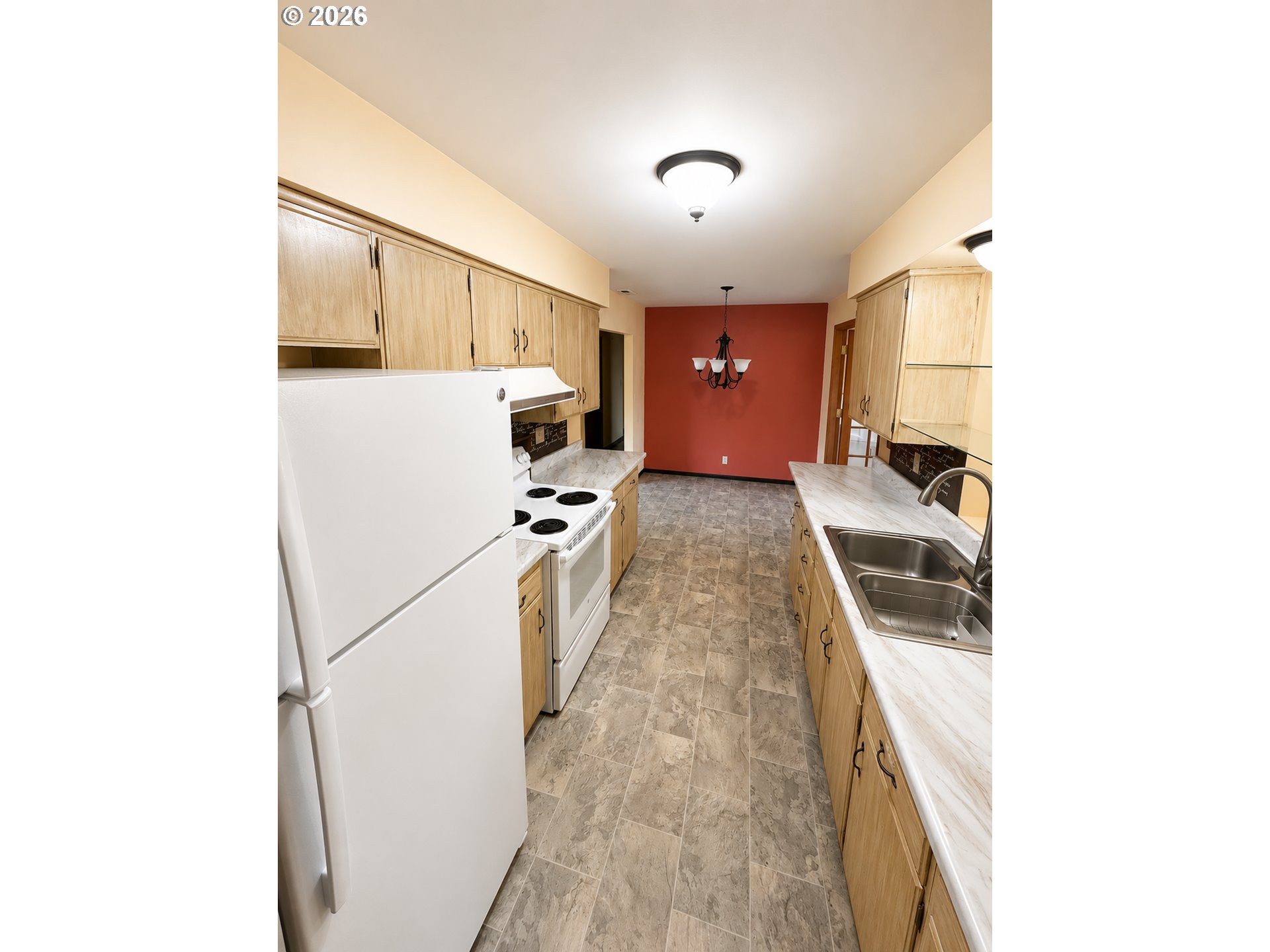 10 Southwest Peach Lane Winston, OR 97496 - Photo 11 of 22 a kitchen with a refrigerator and wooden floor