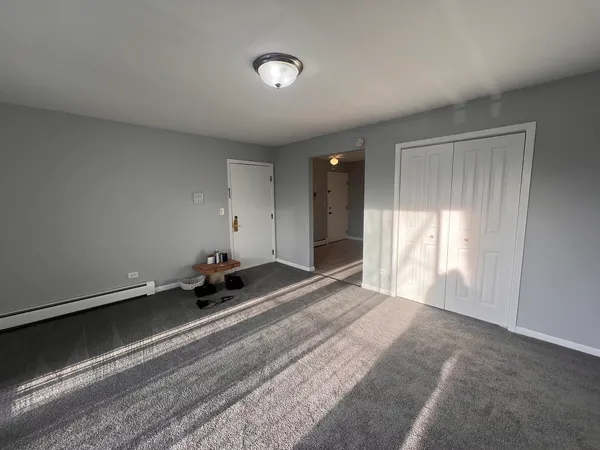 a room with a bed and a window