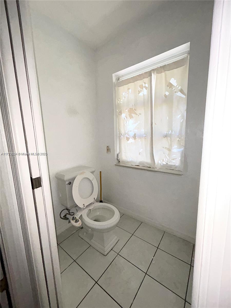 9227 Highway 80 Moore Haven, FL 33471 - Photo 17 of 20 a bathroom with a sink and a mirror