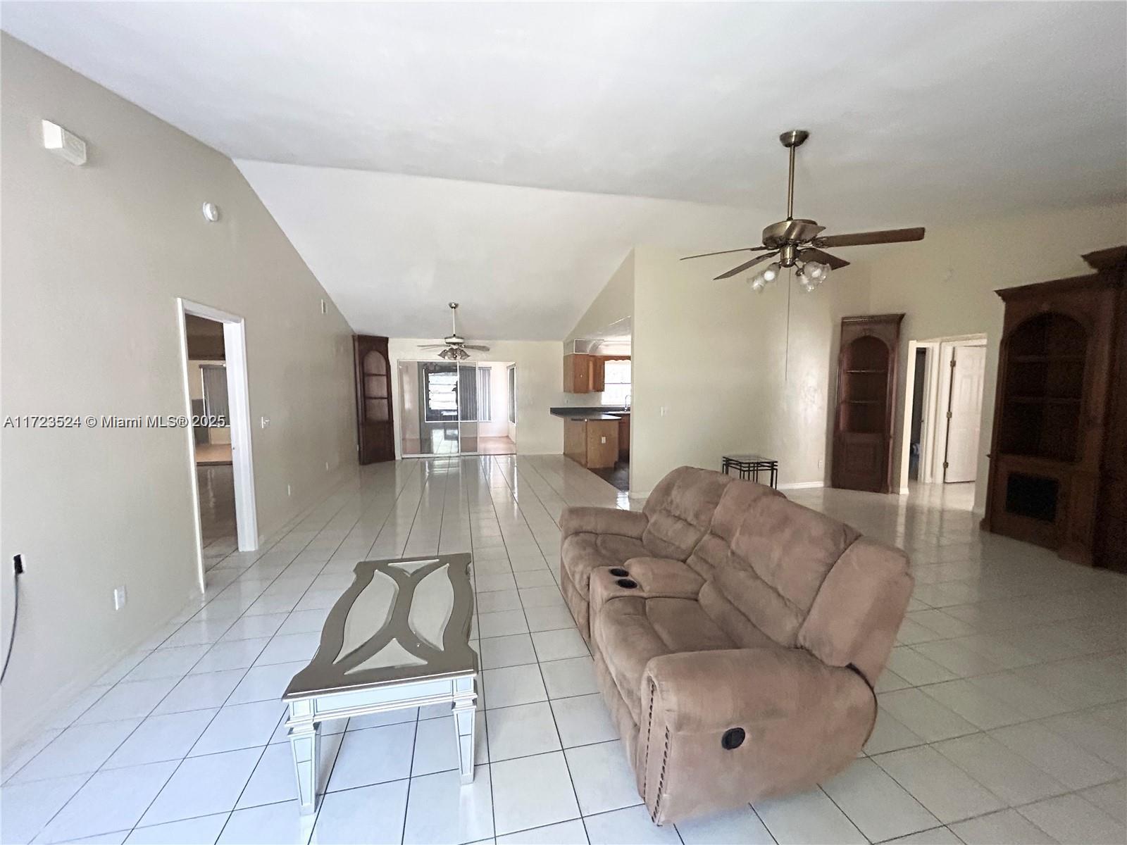 9227 Highway 80 Moore Haven, FL 33471 - Photo 9 of 20 a living room with furniture a dining table and chairs