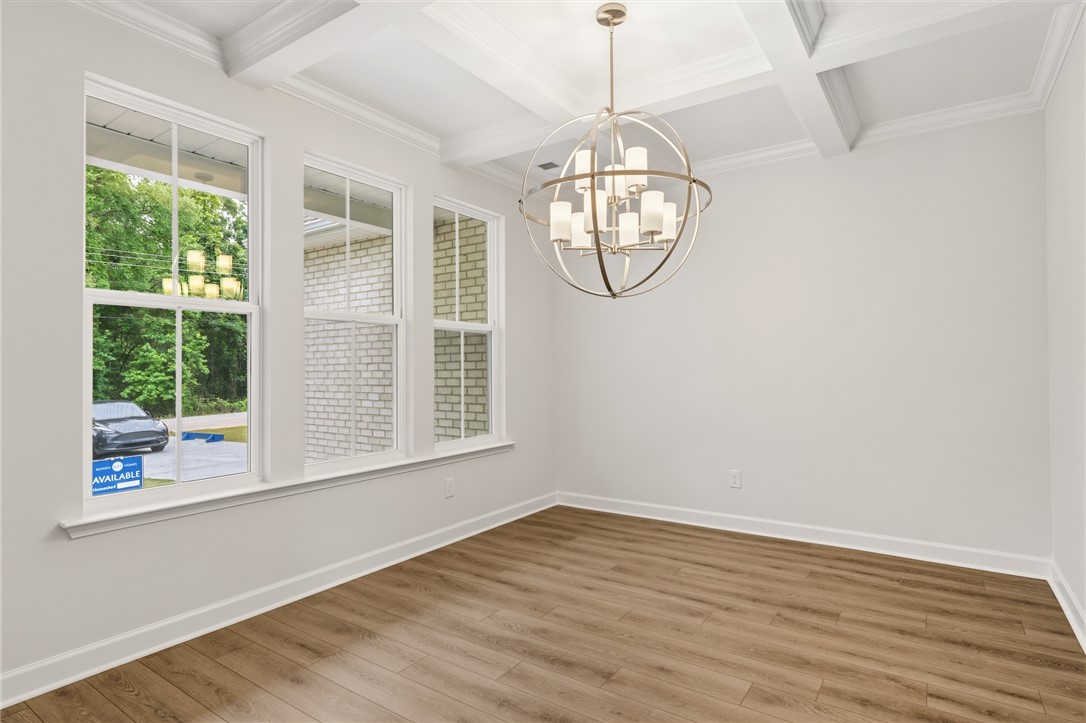 110 Lakeside Drive Anderson, SC 29621 - Photo 5 of 34 This bright room features a striking light fixture and beautiful flooring, ideal for a dining space.