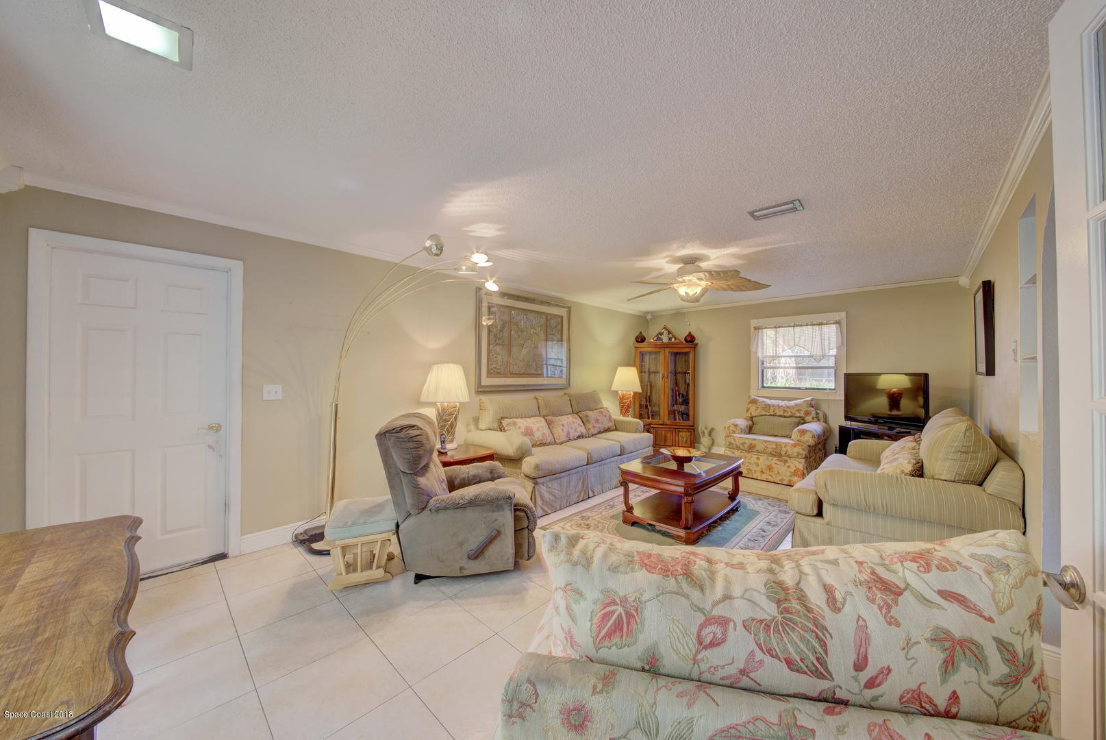 120 East Crisafulli Road Merritt Island, FL 32953 - Photo 22 of 56 Living Room with Tile Floor