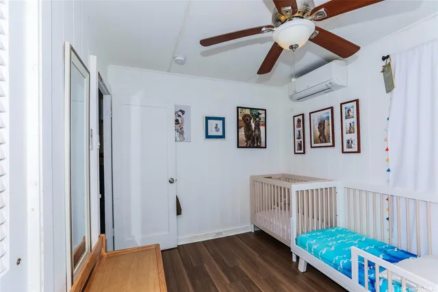 a view of a hallway with wooden floor and stairs