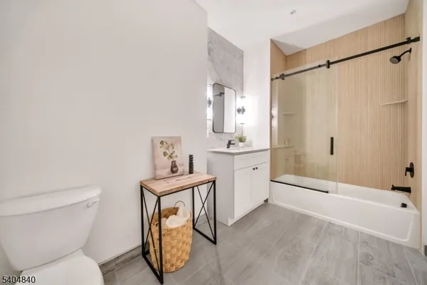 a bathroom with a toilet a sink and a shower