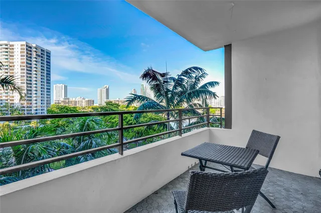 a view of balcony with furniture