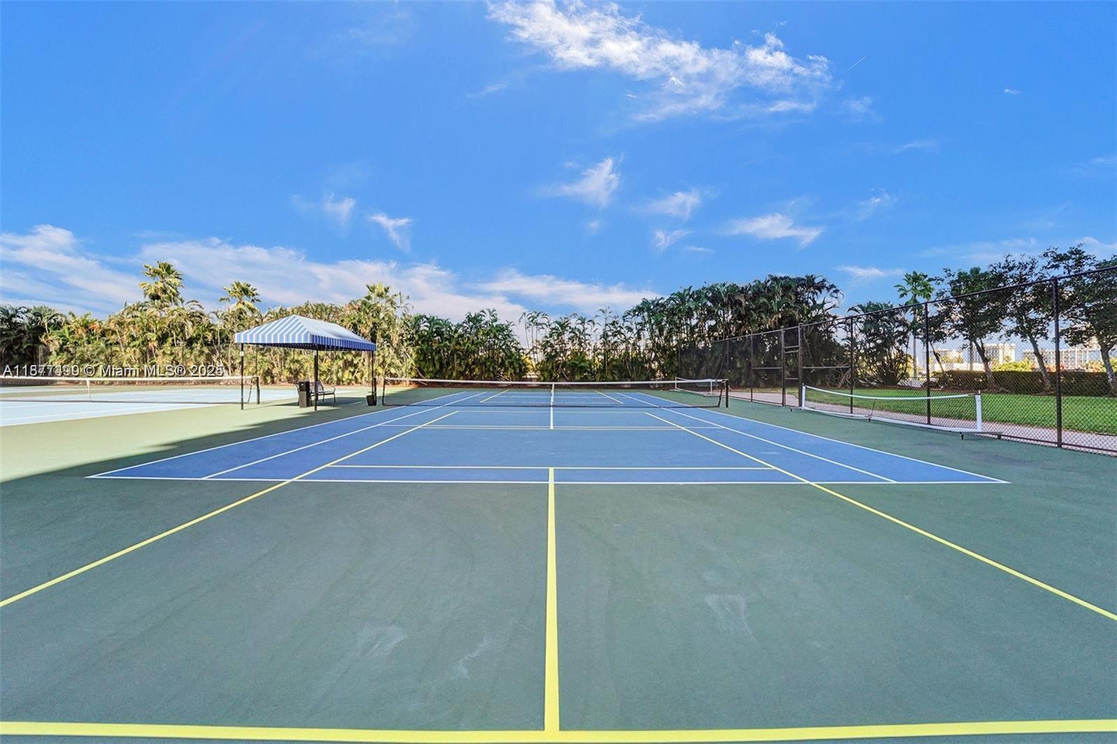 500 Three Islands Boulevard, Unit 320 Hallandale Beach, FL 33009 - Photo 20 of 27 a view of an outdoor space and tennis court
