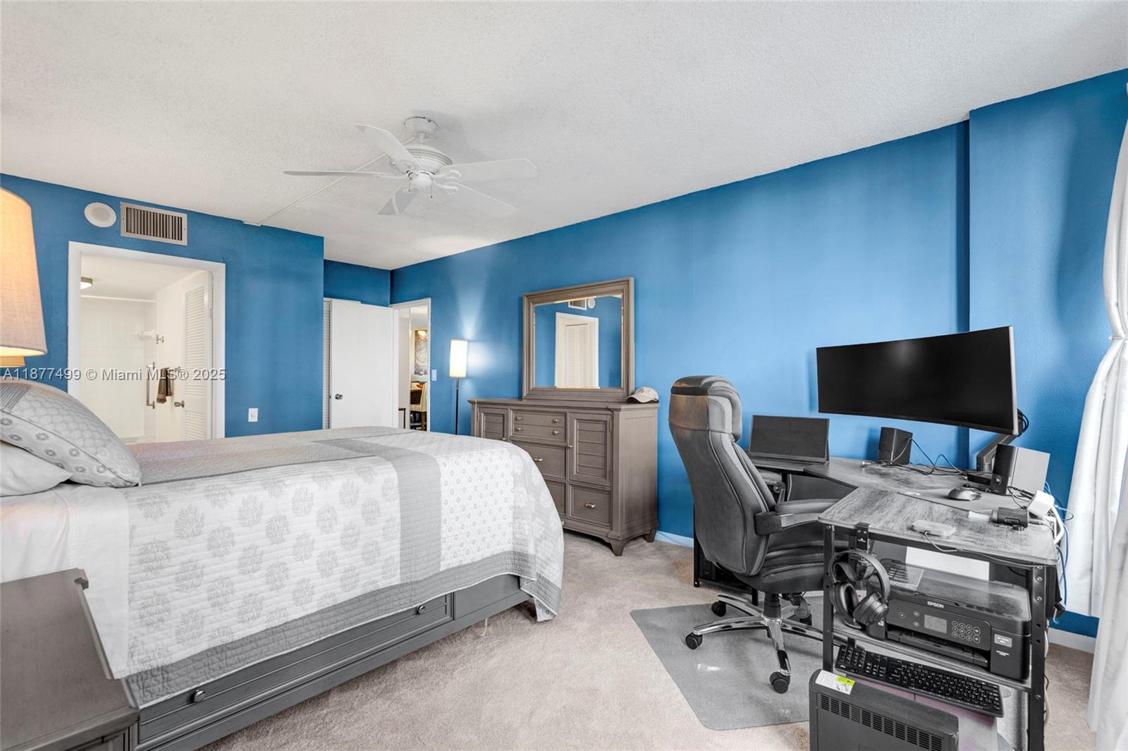 500 Three Islands Boulevard, Unit 320 Hallandale Beach, FL 33009 - Photo 9 of 27 a bedroom with a bed and a flat screen tv