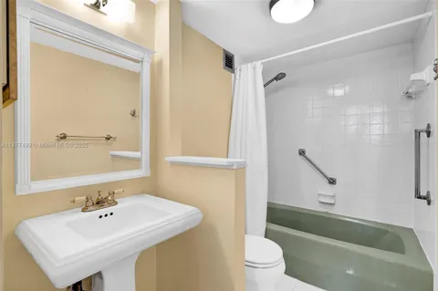 a bathroom with a sink a toilet and a bathtub