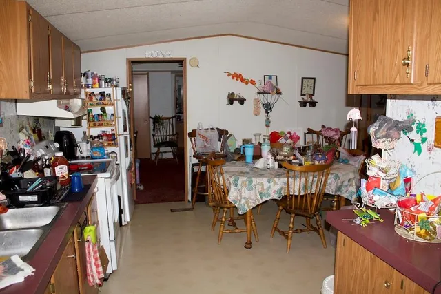 a bedroom with bed and a chandelier