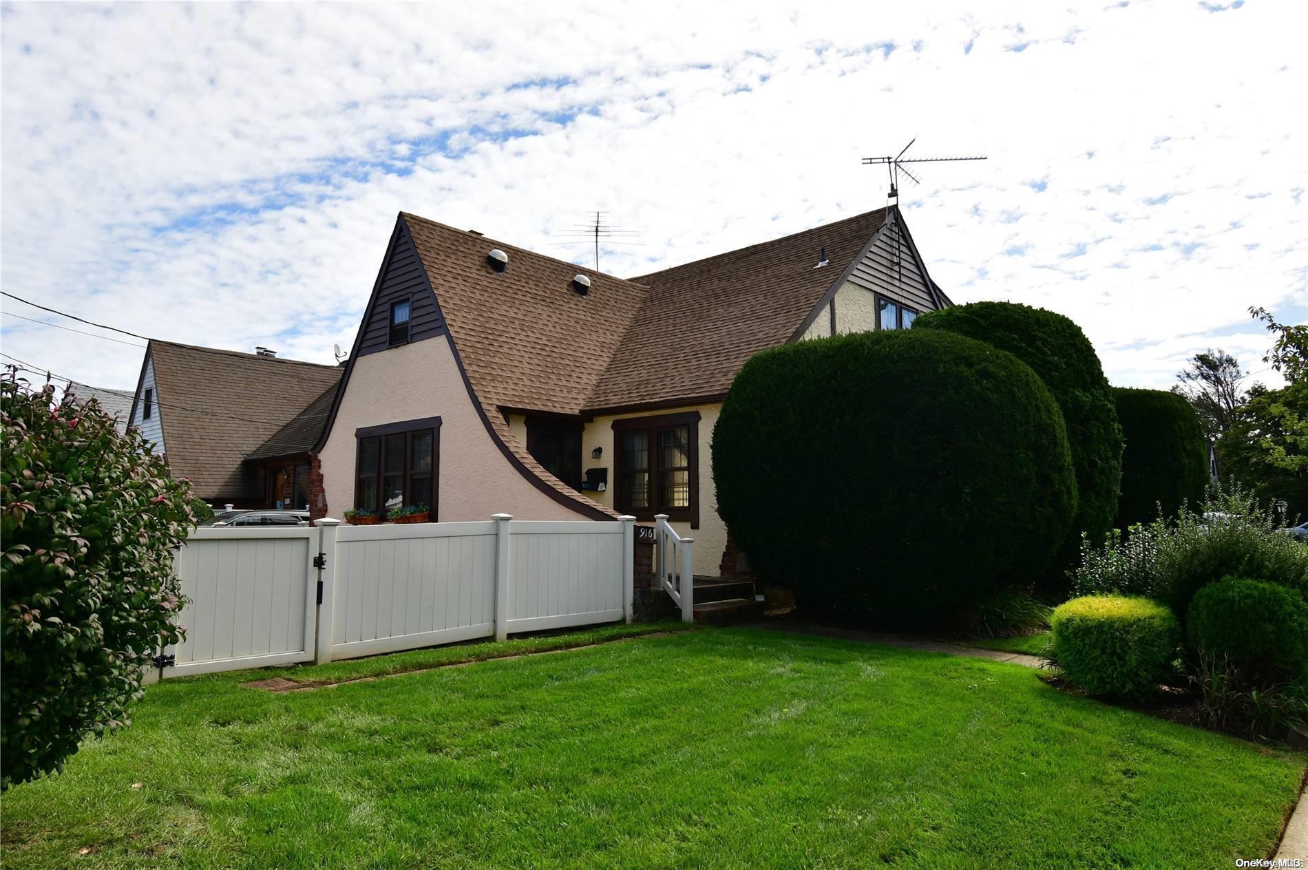 a view of a backyard with potted plants