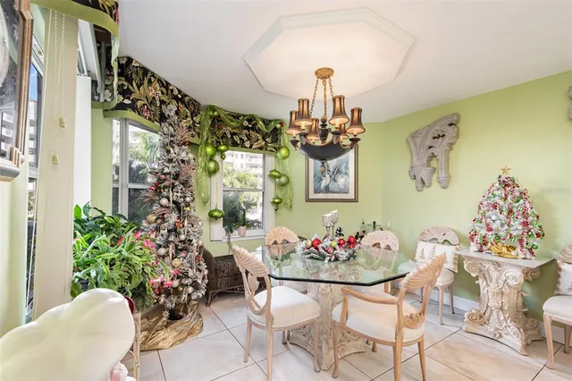 a living room with furniture and flowers