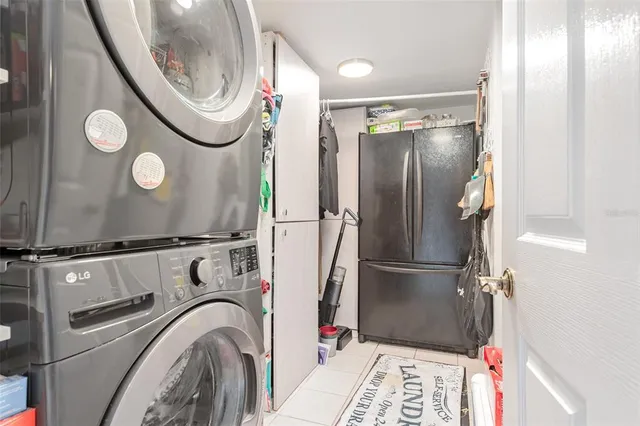 a living room with furniture and a mirror