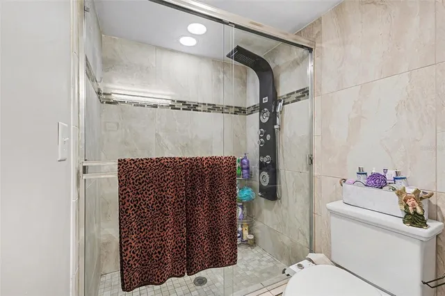 a bedroom with bed and tv