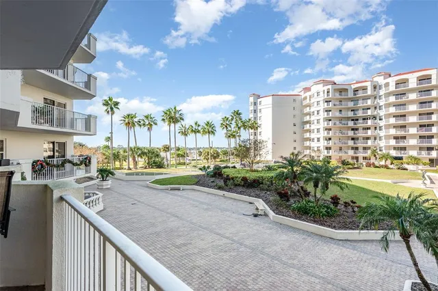 a view of a livingroom with furniture wooden floor and a chandelier