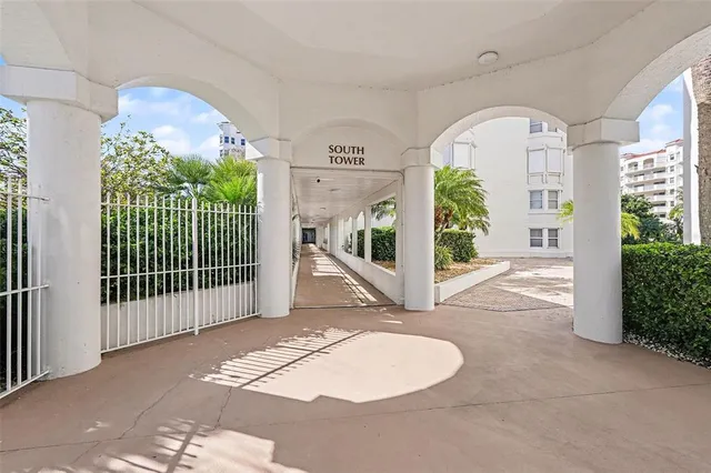 a view of a livingroom with furniture wooden floor and a chandelier