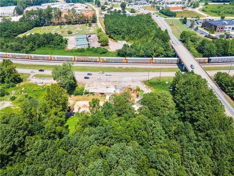 14971 Veterans Memorial Highway Villa Rica, GA 30180 - Photo 2 of 17 an aerial view of residential houses with outdoor space and swimming pool