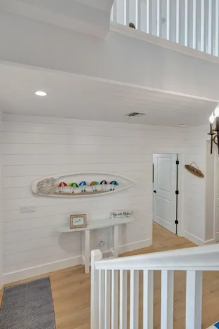 a kitchen with a stove and white cabinets