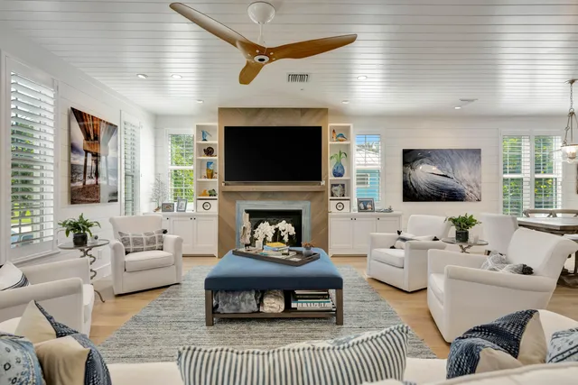 a view of a hallway with wooden floor and stairs